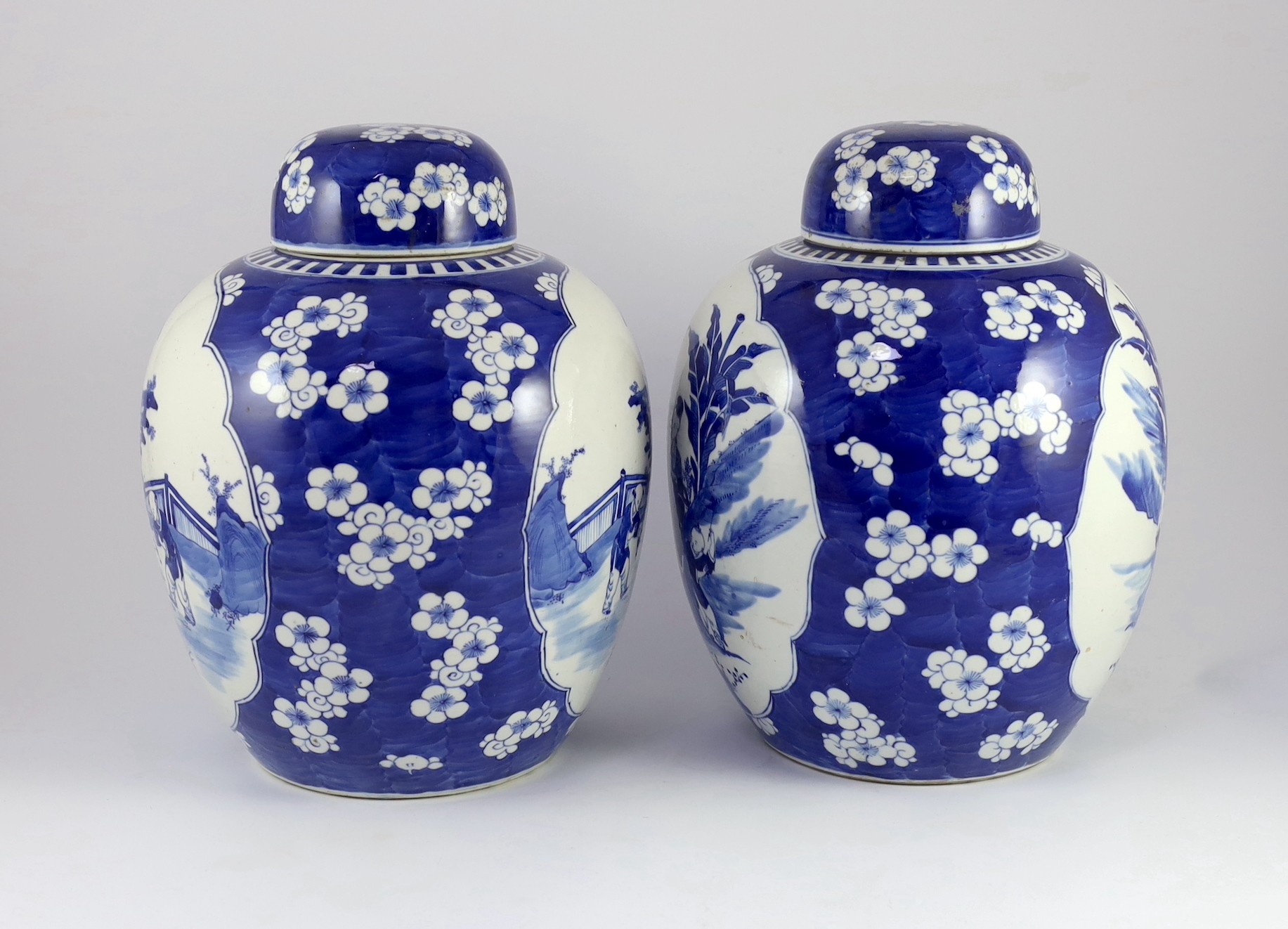 A pair of large Chinese blue and white jars and covers, 19th century, 33cm high